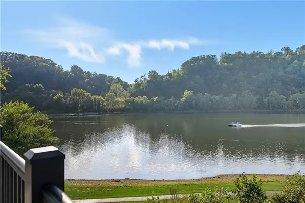 a view of a lake in between two of trees
