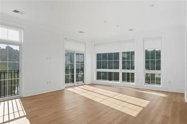 a view of a house with wooden floor and windows