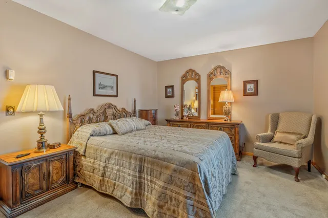 a bedroom with a bed and a couch