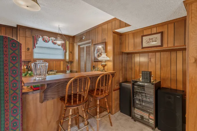 a bedroom with furniture and windows