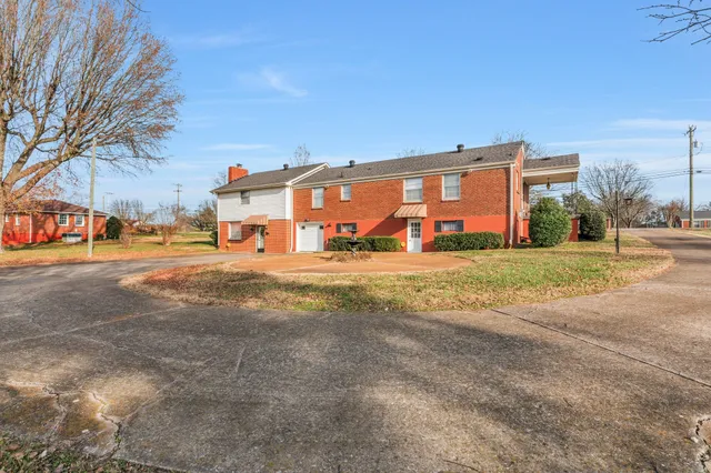 a view of a house with a big yard