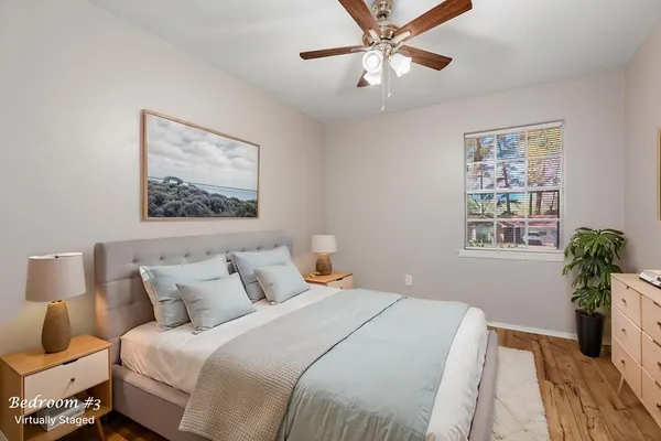 a bedroom with bed and a window