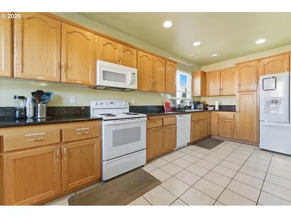a open kitchen with sink and cabinets