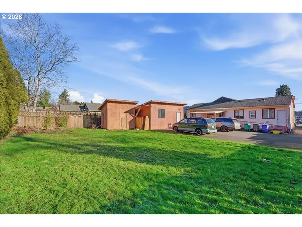 a view of a house with a big yard