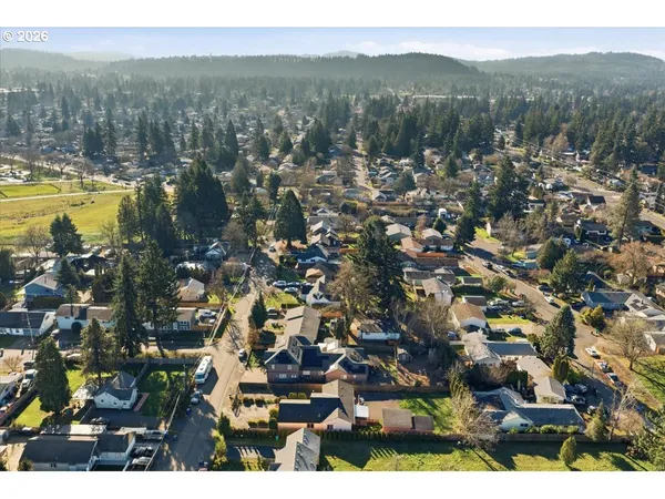 an aerial view of residential building and lake