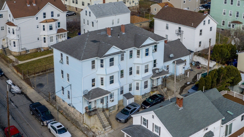 119-121 Tremont Street Fall River, MA 02720 - Photo 2 of 10 an aerial view of multiple houses with a yard