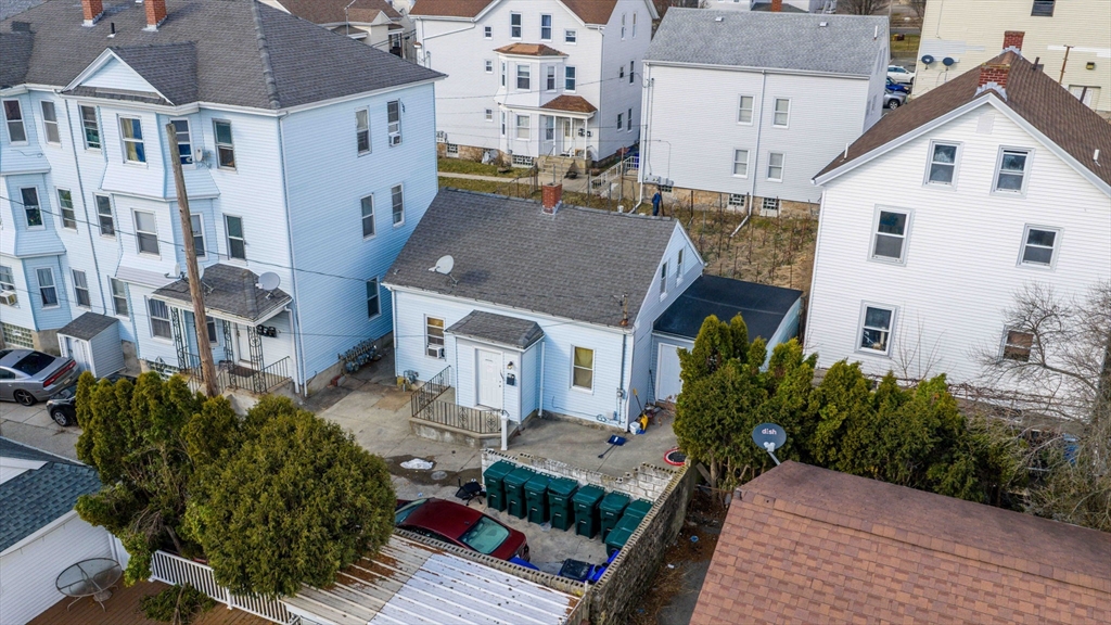 119-121 Tremont Street Fall River, MA 02720 - Photo 4 of 10 a aerial view of multiple houses with a yard