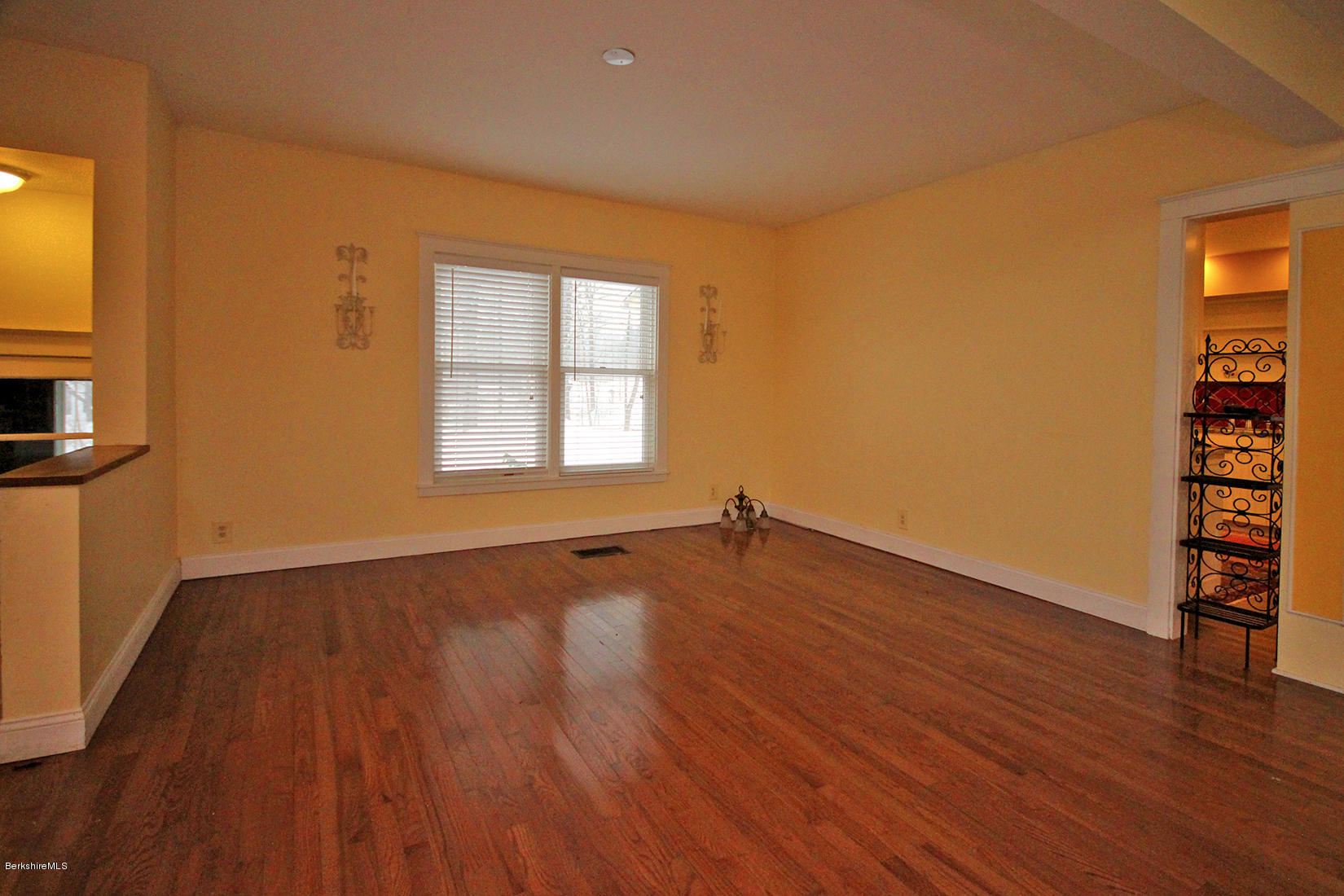 27 Interlaken Road Stockbridge, MA 01266 - Photo 14 of 34 an empty room with wooden floor and windows