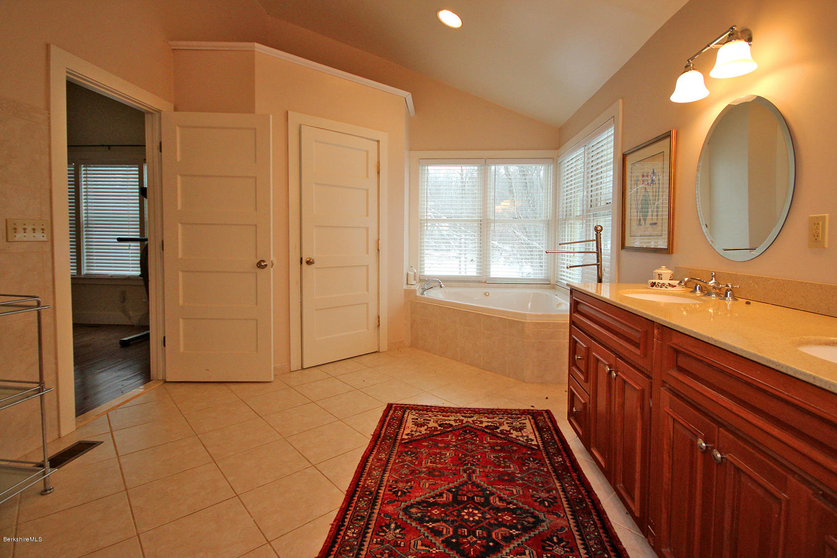 27 Interlaken Road Stockbridge, MA 01266 - Photo 22 of 34 a spacious bathroom with a double vanity sink a mirror and a bathtub