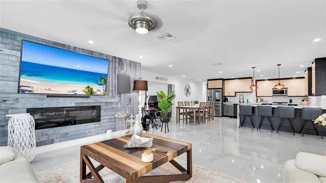 a large kitchen with a table and chairs