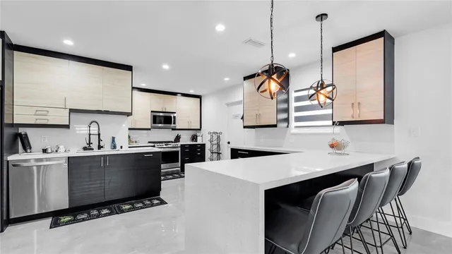 a kitchen with a sink and cabinets