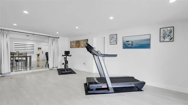 a bedroom with a bed and a book shelf