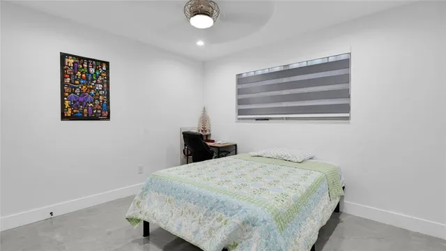 a bedroom with a bed and a chair