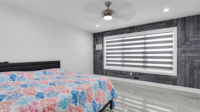 a bedroom with a bed and a rug