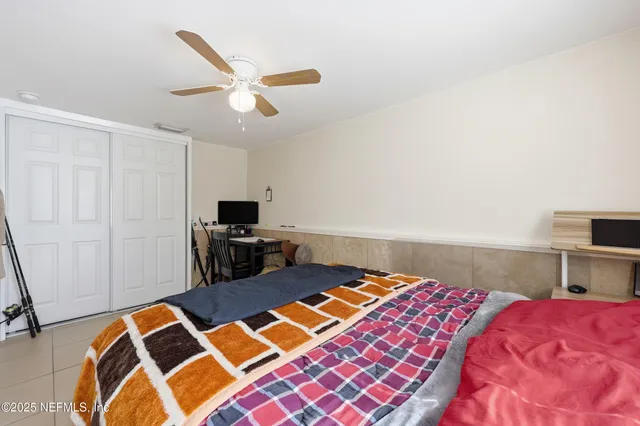 a kitchen with kitchen island granite countertop a stove a sink and a refrigerator