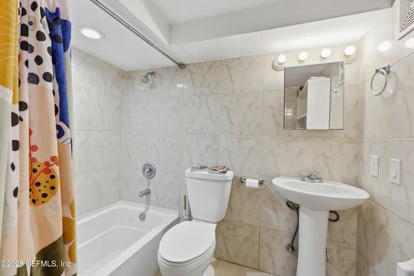 a kitchen with stainless steel appliances granite countertop a refrigerator a sink dishwasher with a stove and refrigerator