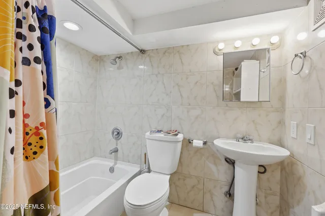 a kitchen with stainless steel appliances granite countertop a refrigerator a sink dishwasher with a stove and refrigerator