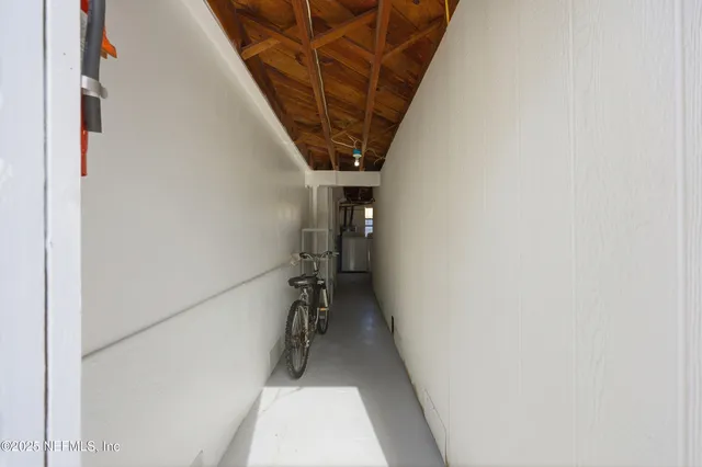 a bedroom with a bed and a ceiling fan