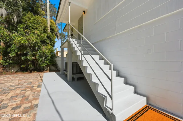 a bathroom with a sink toilet and a mirror