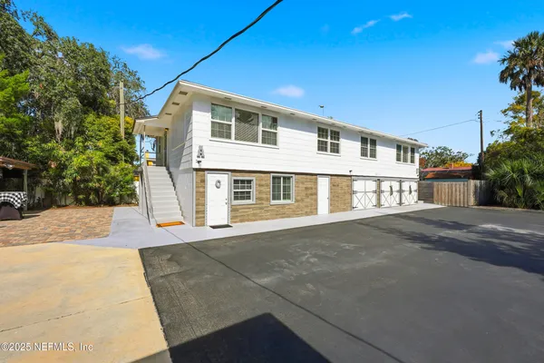 a kitchen with stainless steel appliances a stove a sink and a refrigerator
