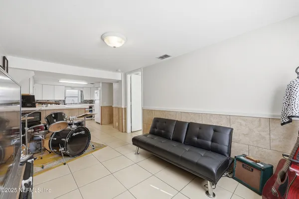 a kitchen with stainless steel appliances a refrigerator sink and cabinets