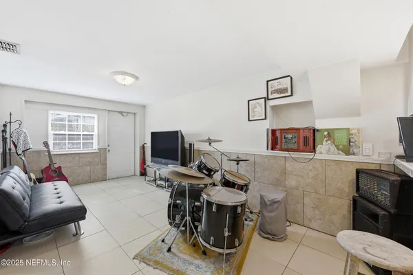 a view of staircase with railing and white walls