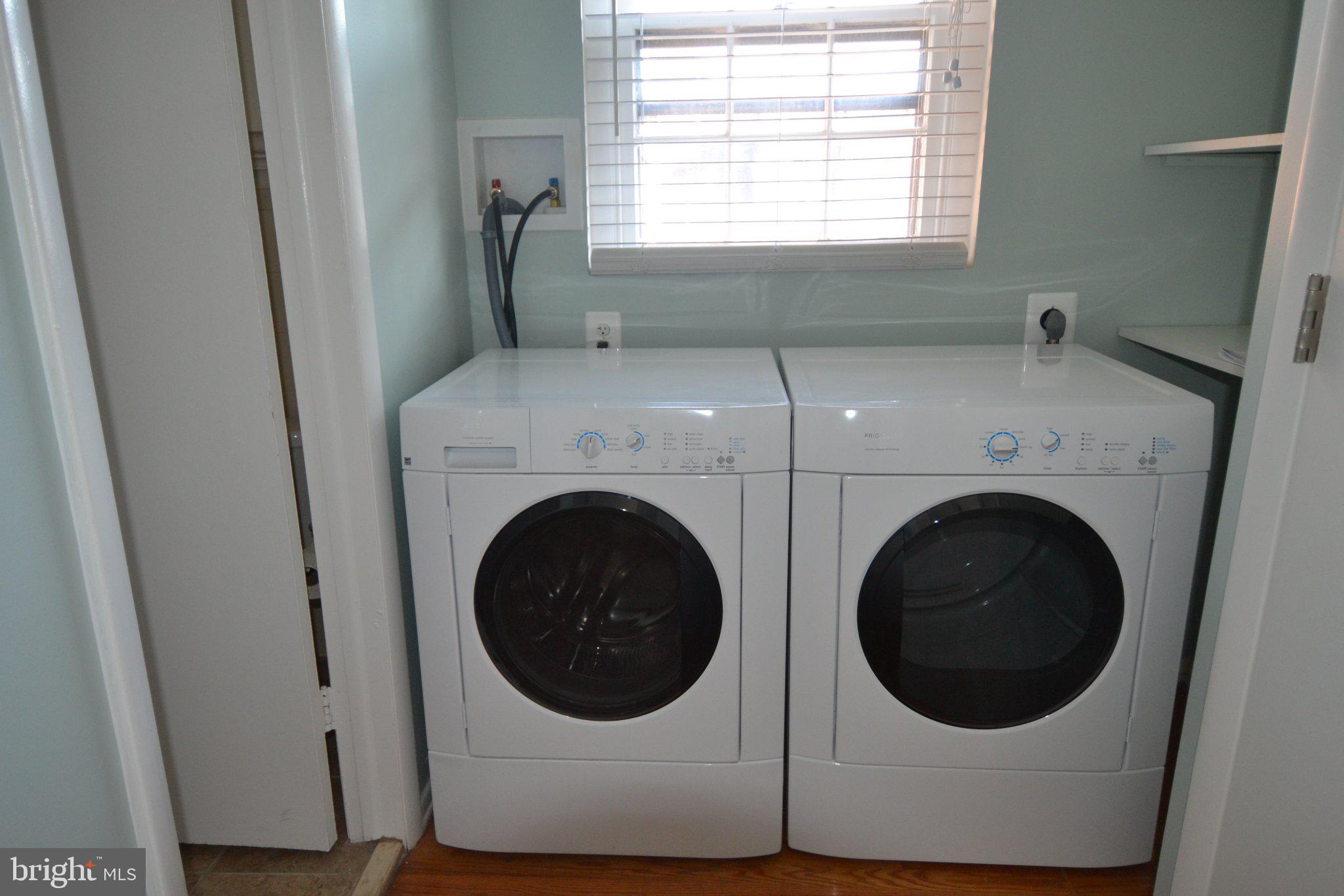 1010 Clinton Street, Unit 3M Philadelphia, PA 19107 - Photo 14 of 15 Modern laundry space with natural light.
