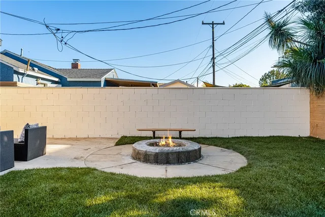 a bedroom with a bed and a potted plant