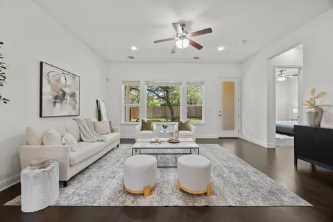 a living room with furniture and a large window