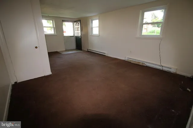 a view of empty room with windows