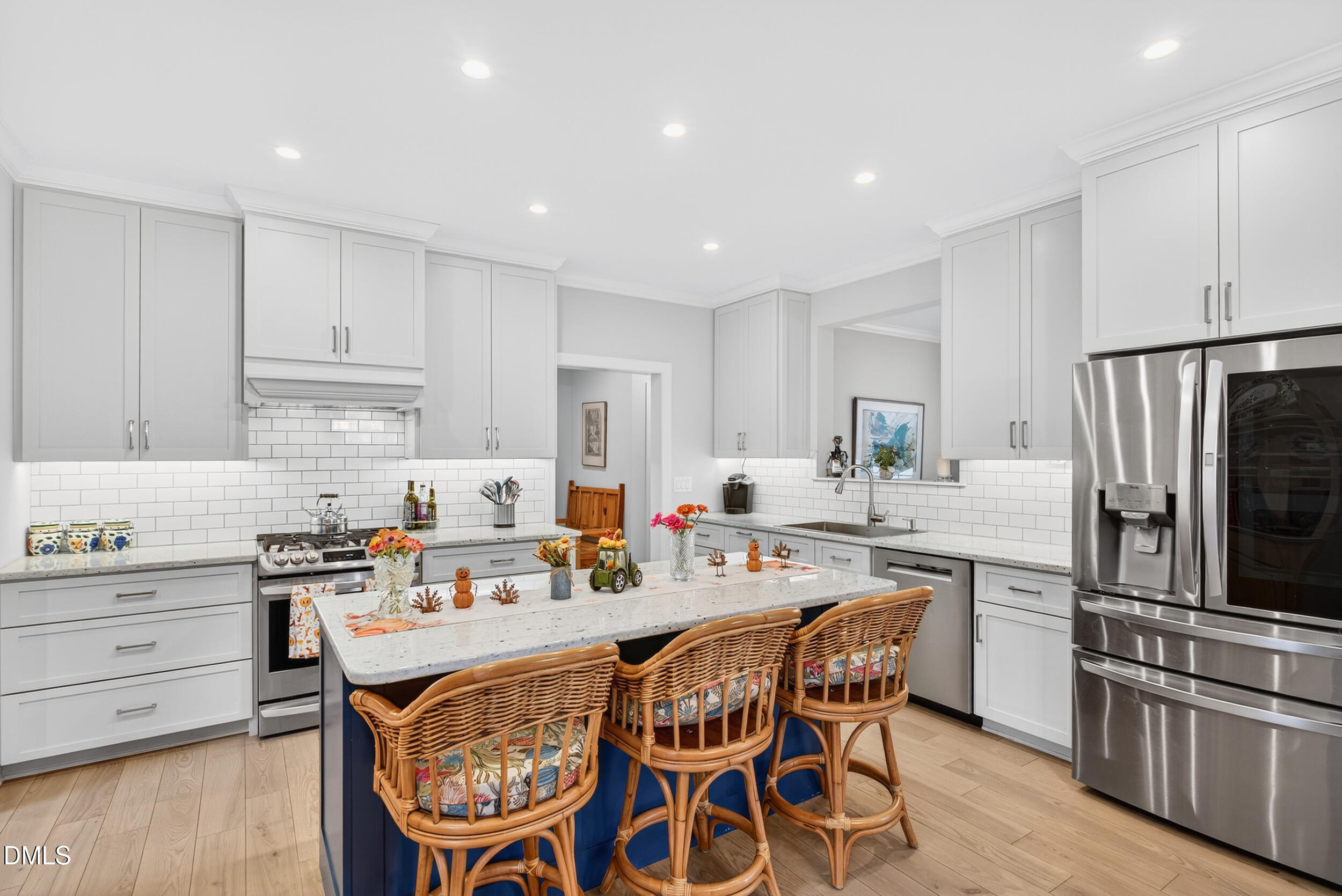 7528 McBane Mill Road Graham, NC 27253 - Photo 12 of 46 a kitchen with stainless steel appliances a stove a sink island and a refrigerator