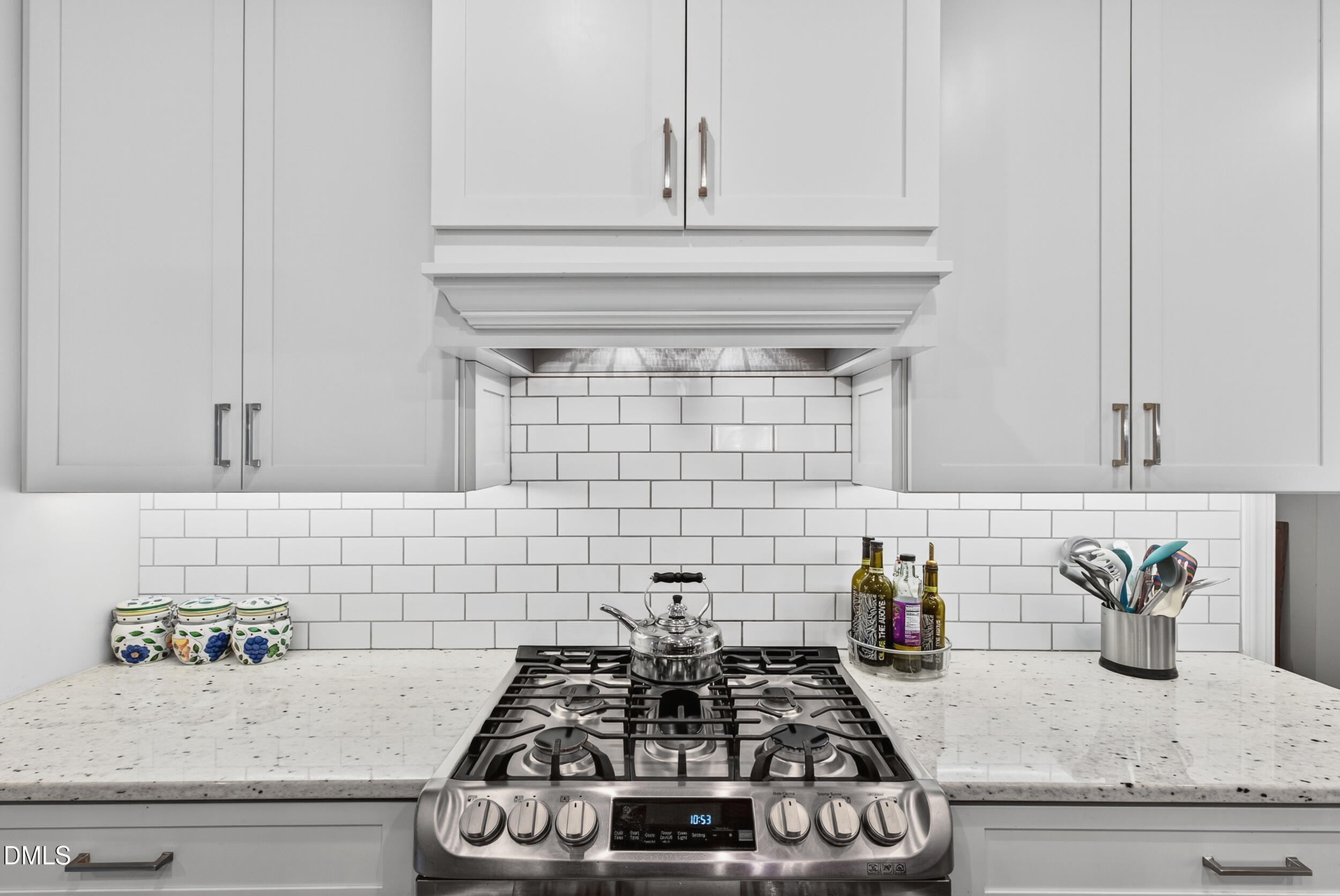 7528 McBane Mill Road Graham, NC 27253 - Photo 15 of 46 a kitchen with a stove and cabinets