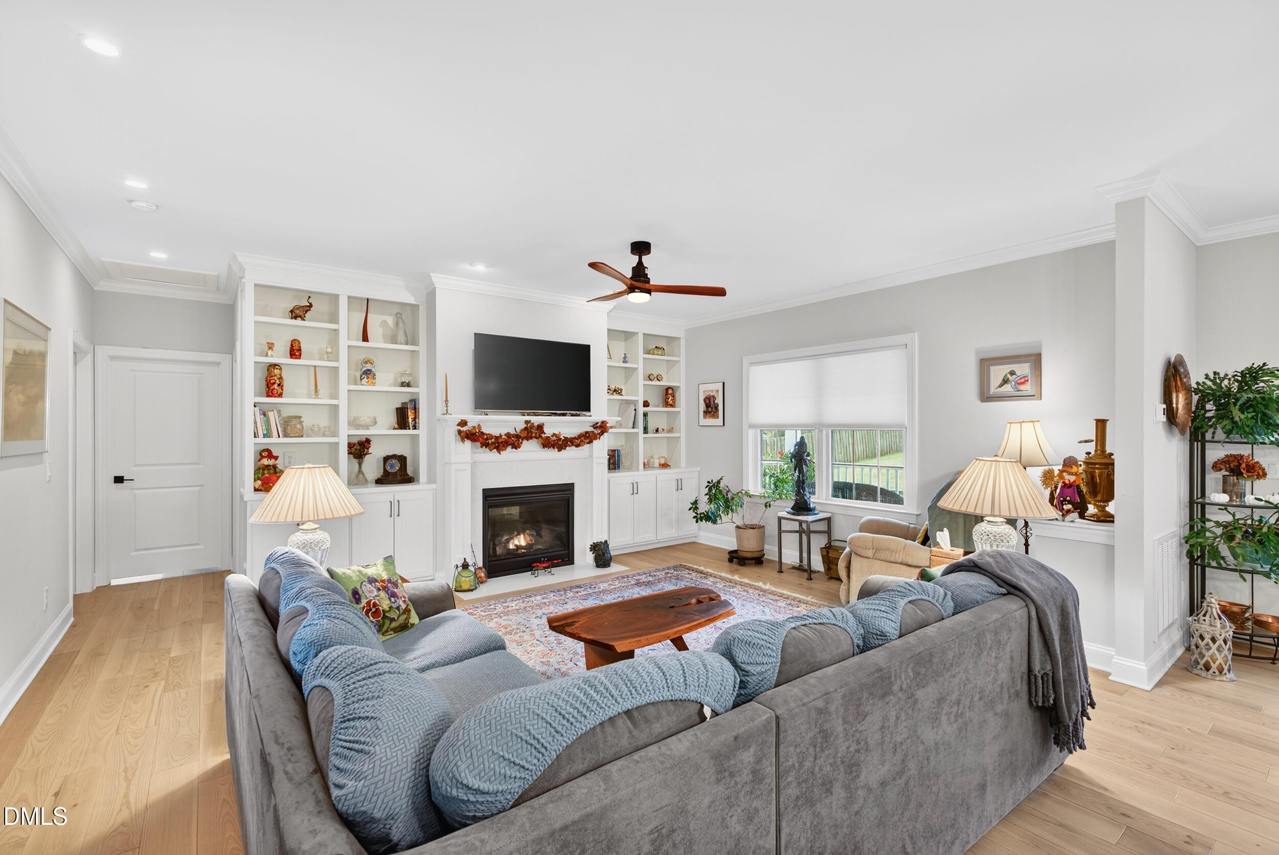 7528 McBane Mill Road Graham, NC 27253 - Photo 22 of 46 a living room with furniture a fireplace and a flat screen tv