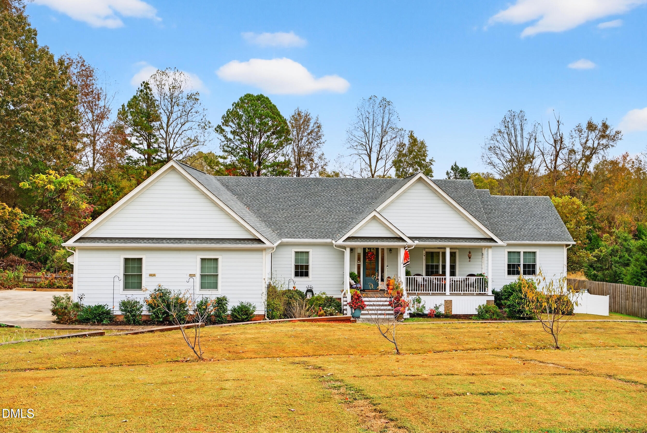 7528 McBane Mill Road Graham, NC 27253 - Photo 3 of 46 a front view of a house with a yard and potted plants