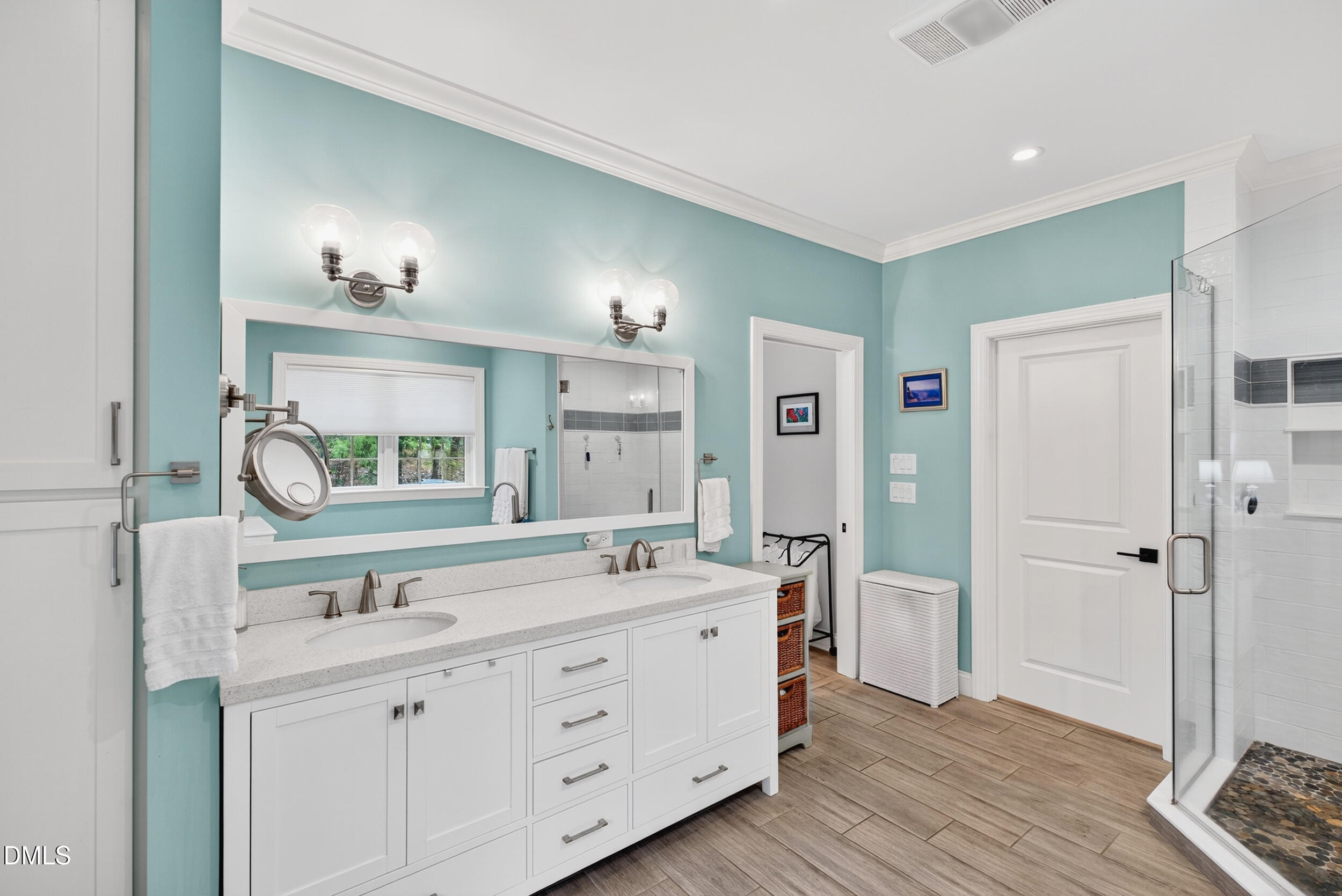 7528 McBane Mill Road Graham, NC 27253 - Photo 31 of 46 a spacious bathroom with a double vanity sink a mirror and shower