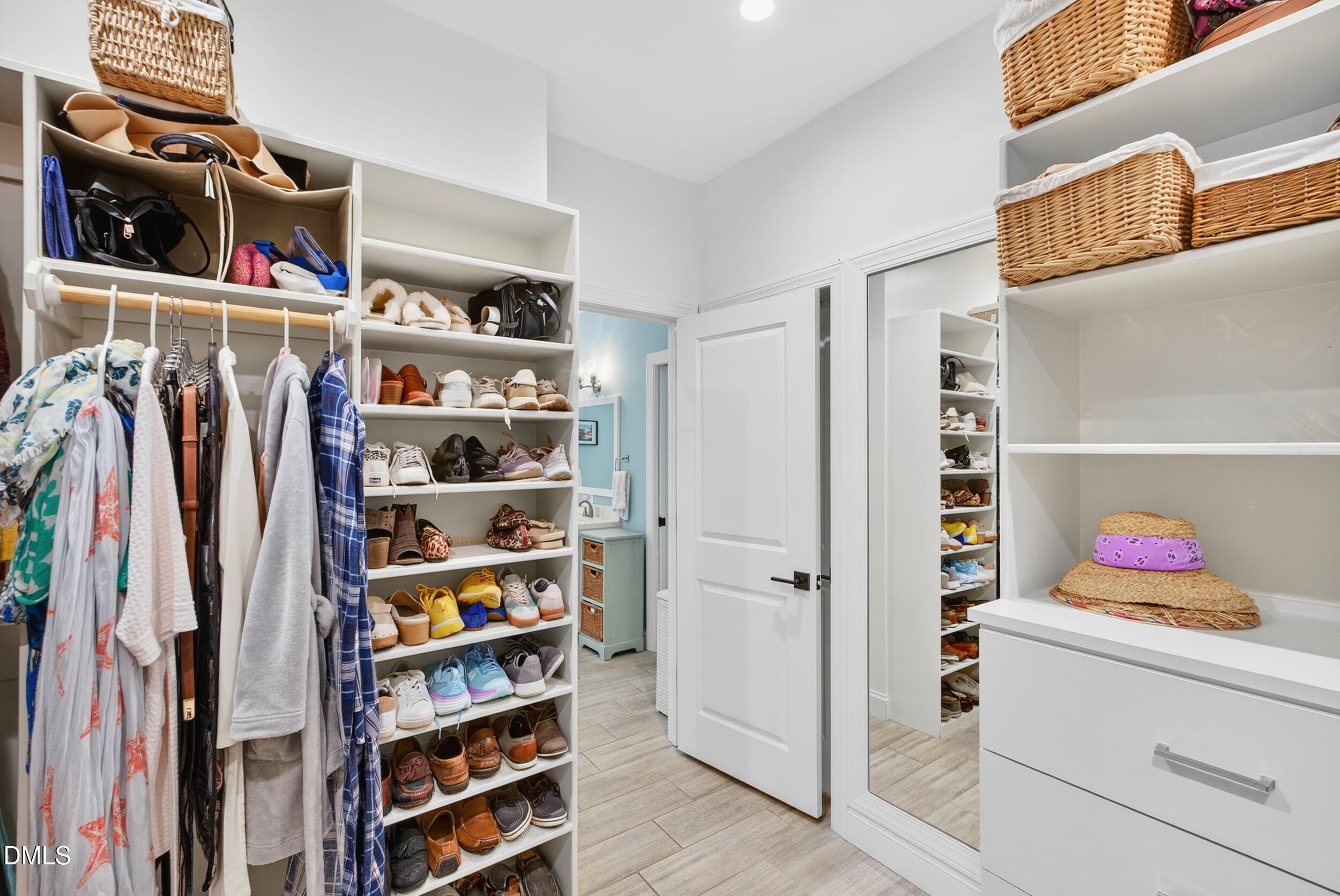 7528 McBane Mill Road Graham, NC 27253 - Photo 32 of 46 a view of walk in closet with clothes and shoes