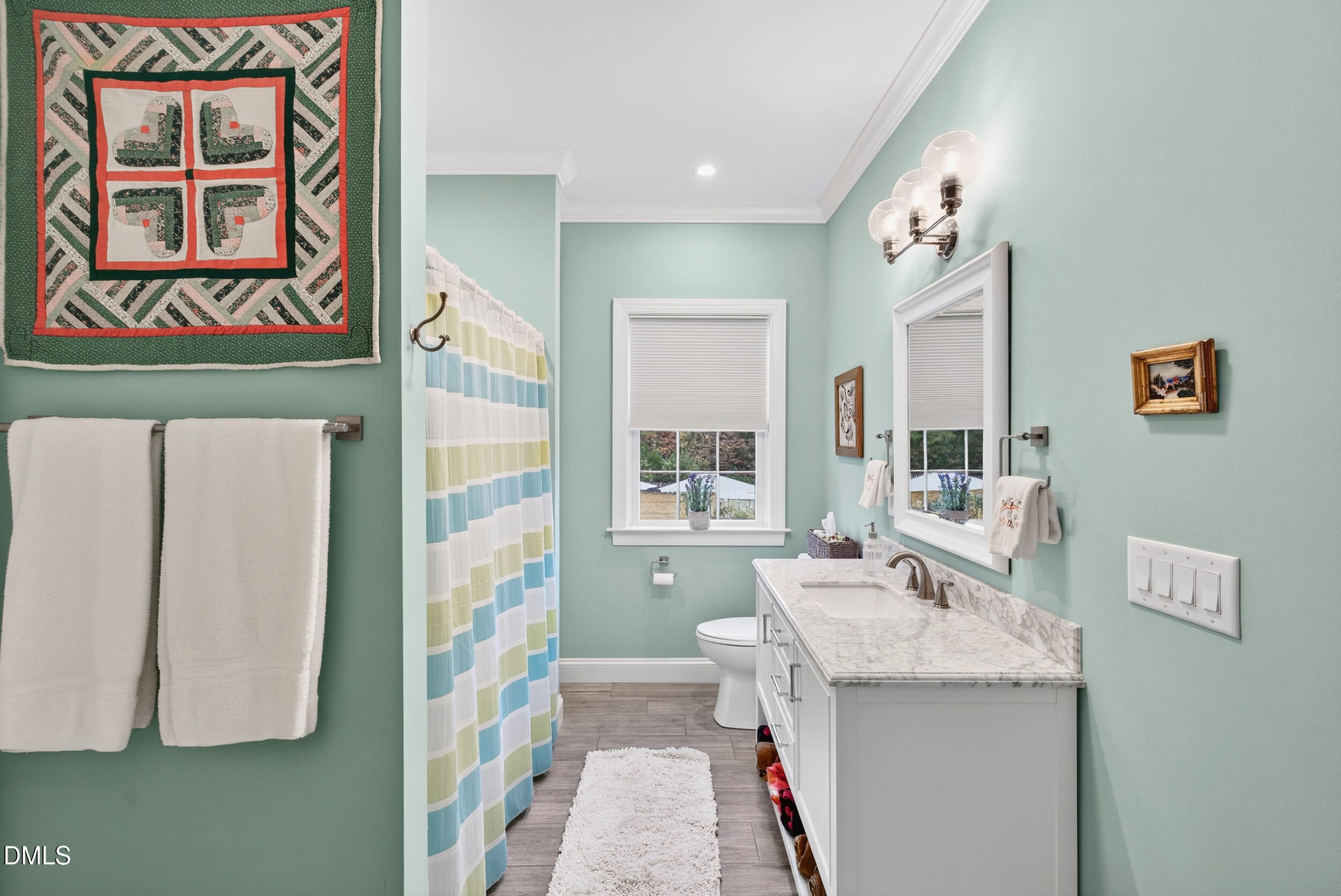 7528 McBane Mill Road Graham, NC 27253 - Photo 35 of 46 a bathroom with a sink a mirror and a shower