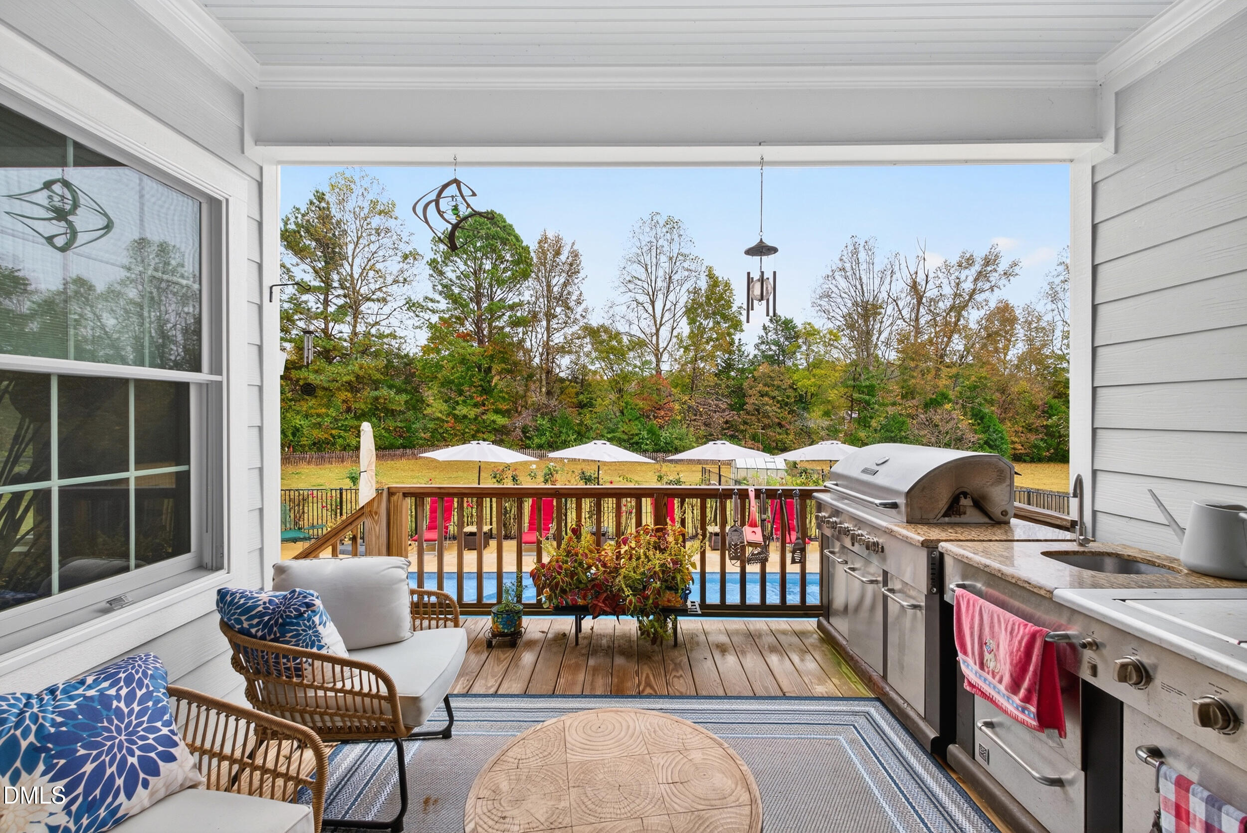 7528 McBane Mill Road Graham, NC 27253 - Photo 38 of 46 a outdoor living space with furniture and a potted plant