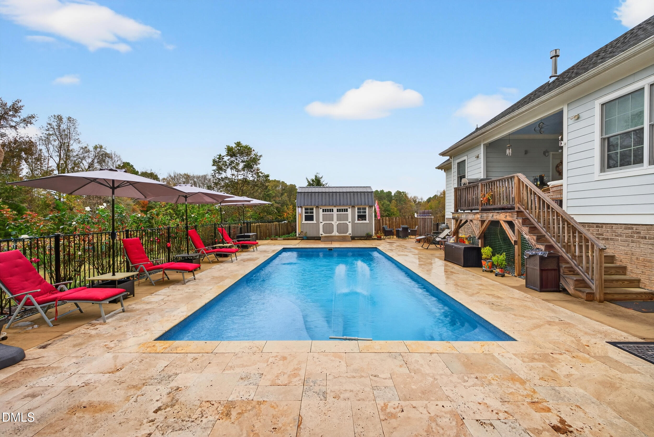 7528 McBane Mill Road Graham, NC 27253 - Photo 39 of 46 a view of a swimming pool with sitting area