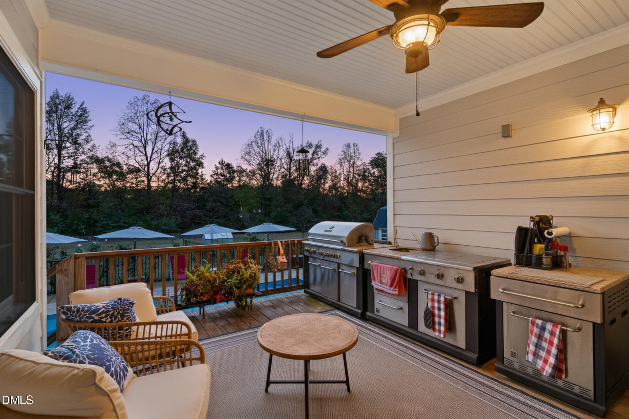 7528 McBane Mill Road Graham, NC 27253 - Photo 7 of 46 a living room with furniture a fireplace and a flat screen tv