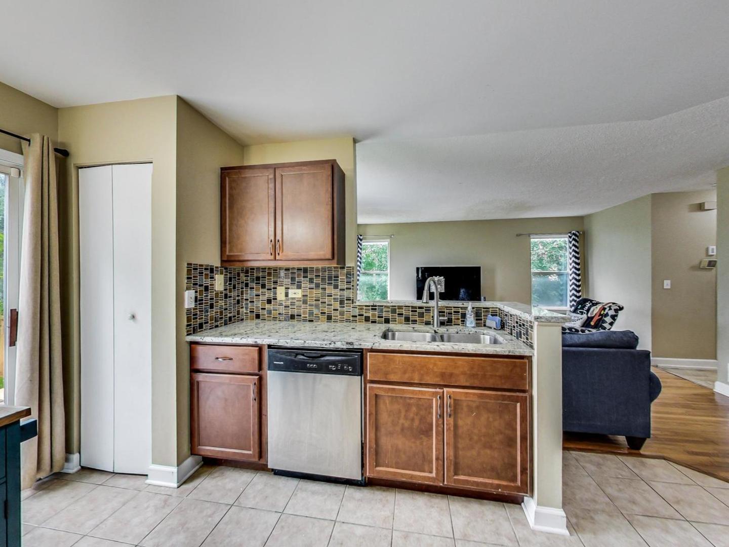 2385 North Periwinkle Way Round Lake Beach, IL 60073 - Photo 13 of 51 a kitchen with a stove top oven and cabinets