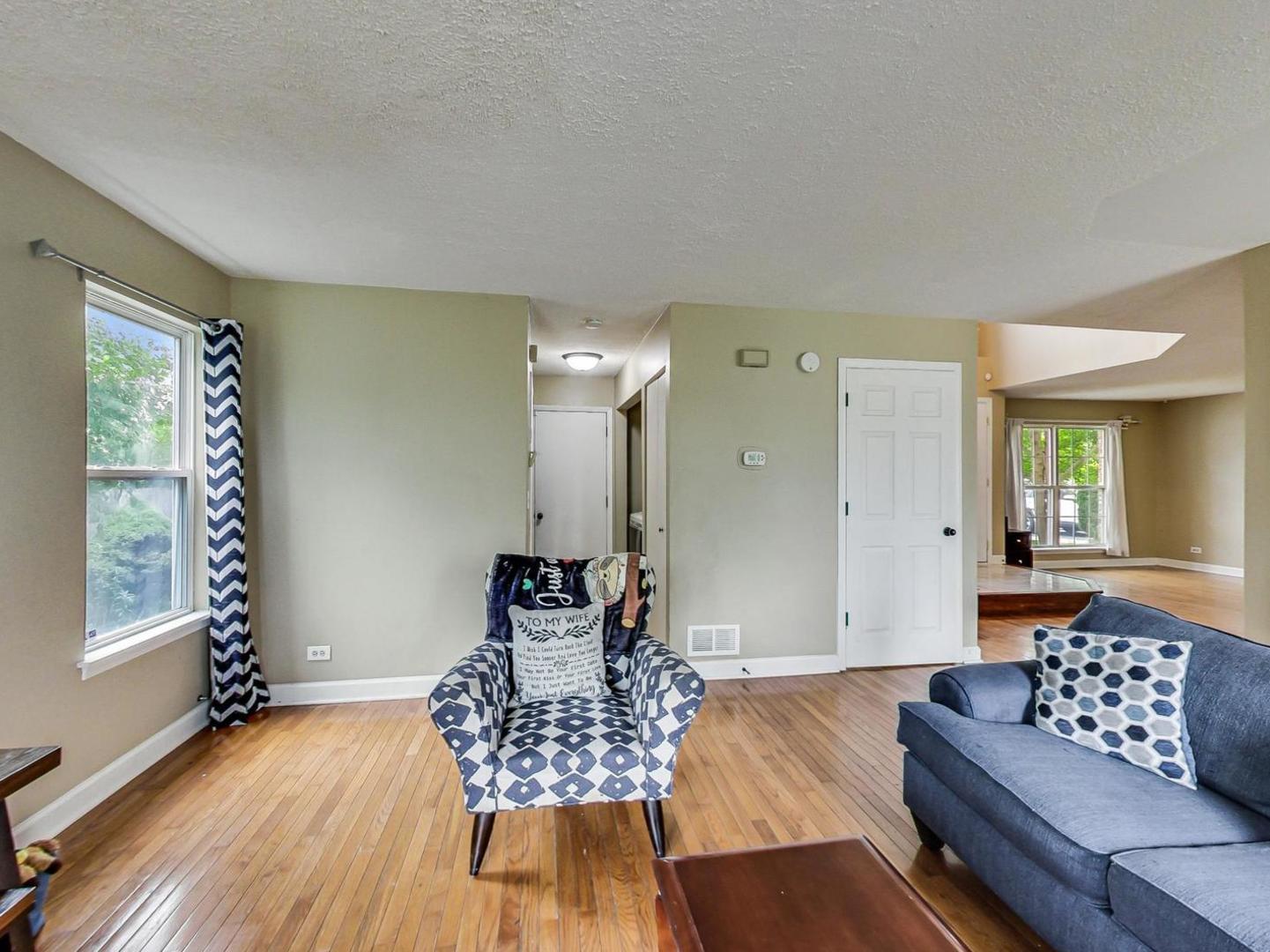 2385 North Periwinkle Way Round Lake Beach, IL 60073 - Photo 17 of 51 a living room with furniture and a wooden floor