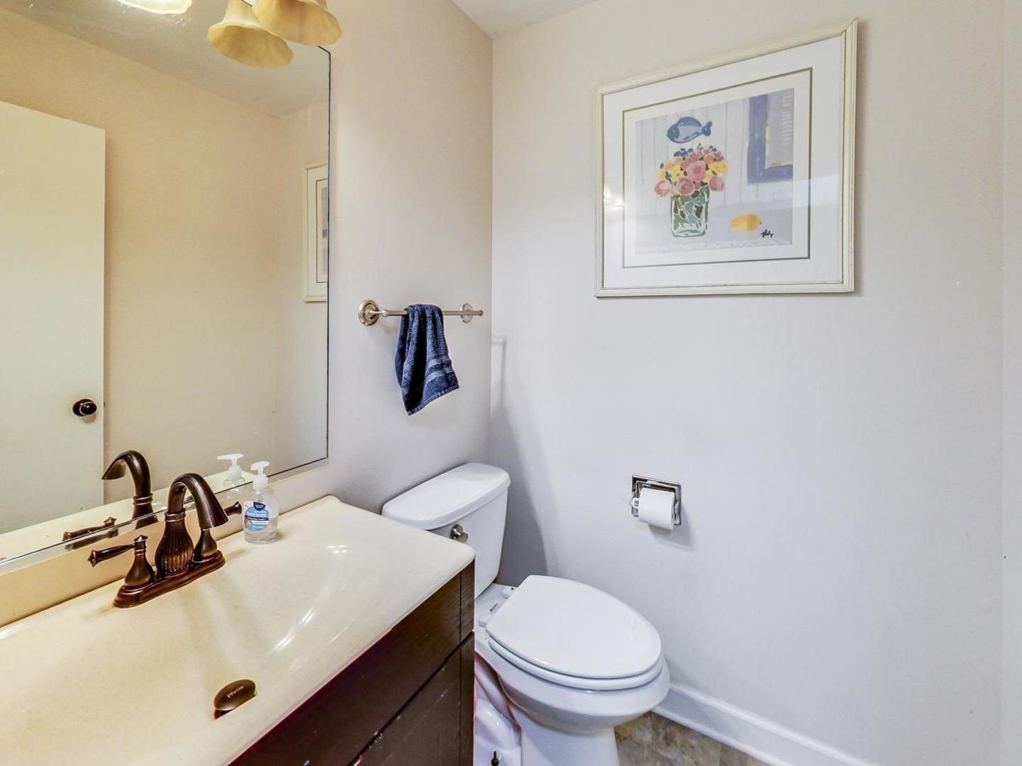2385 North Periwinkle Way Round Lake Beach, IL 60073 - Photo 18 of 51 a bathroom with a sink and a toilet