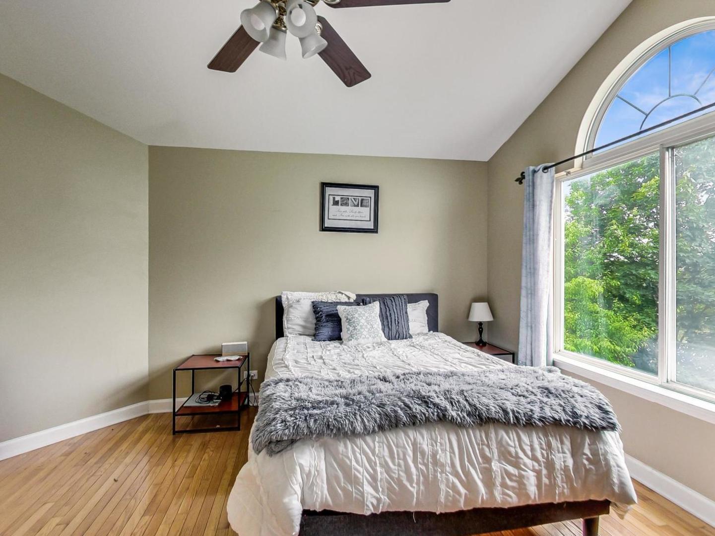 2385 North Periwinkle Way Round Lake Beach, IL 60073 - Photo 22 of 51 a bedroom with a bed and a window