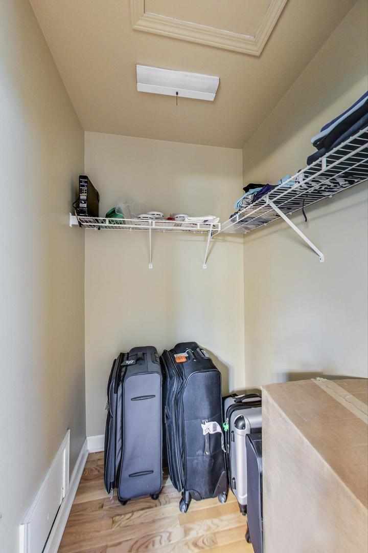 2385 North Periwinkle Way Round Lake Beach, IL 60073 - Photo 24 of 51 a view of storage and utility room with racks on the wall