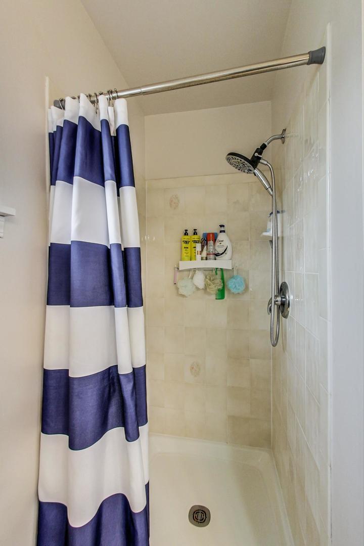 2385 North Periwinkle Way Round Lake Beach, IL 60073 - Photo 27 of 51 a bathroom with a bathtub and a shower