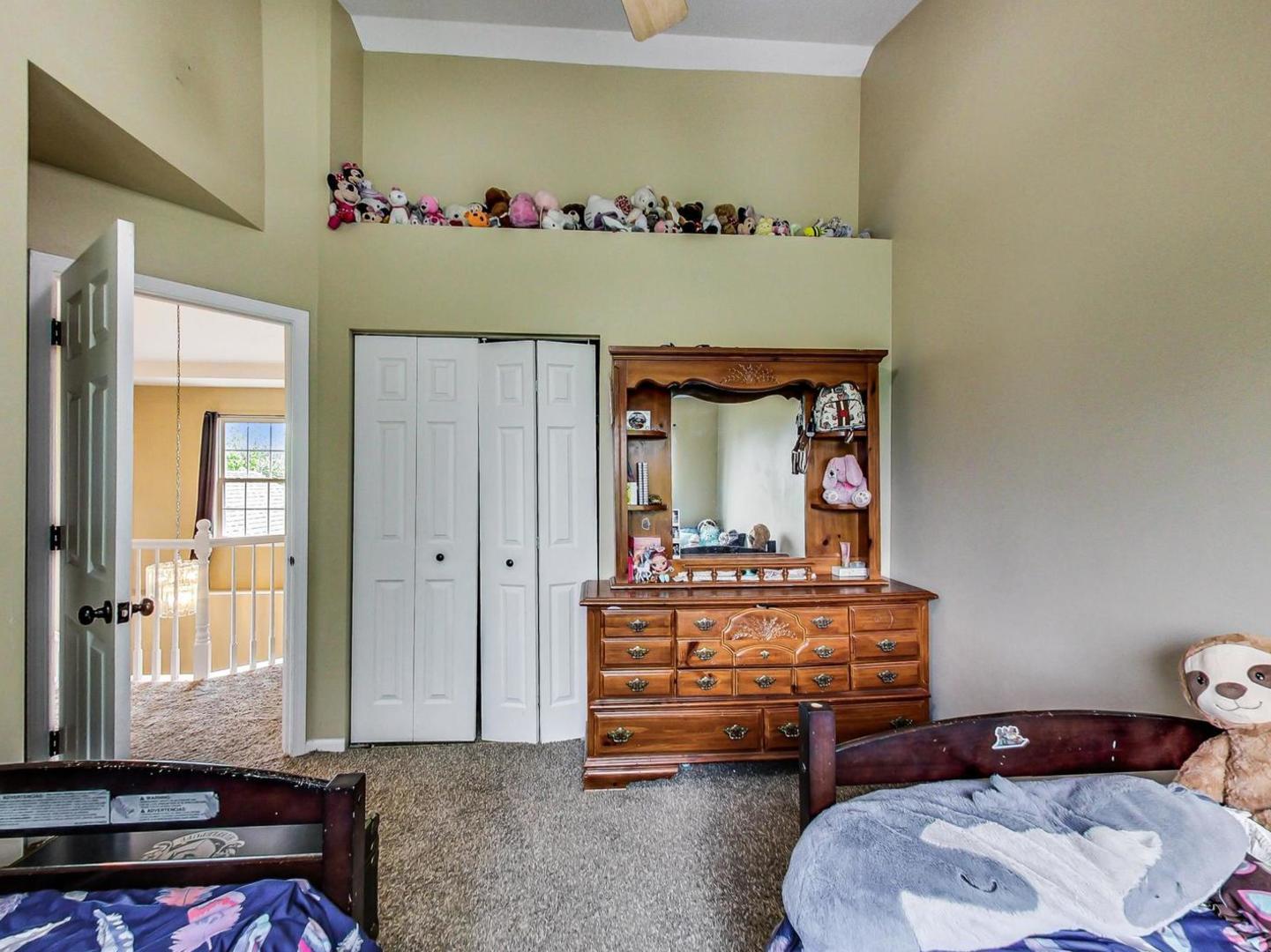 2385 North Periwinkle Way Round Lake Beach, IL 60073 - Photo 29 of 51 a living room with furniture and a window
