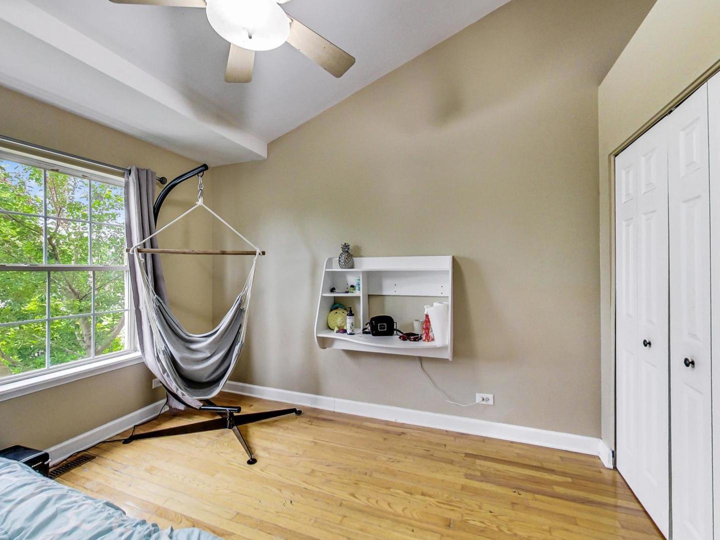 2385 North Periwinkle Way Round Lake Beach, IL 60073 - Photo 31 of 51 a room with gym equipment and large window