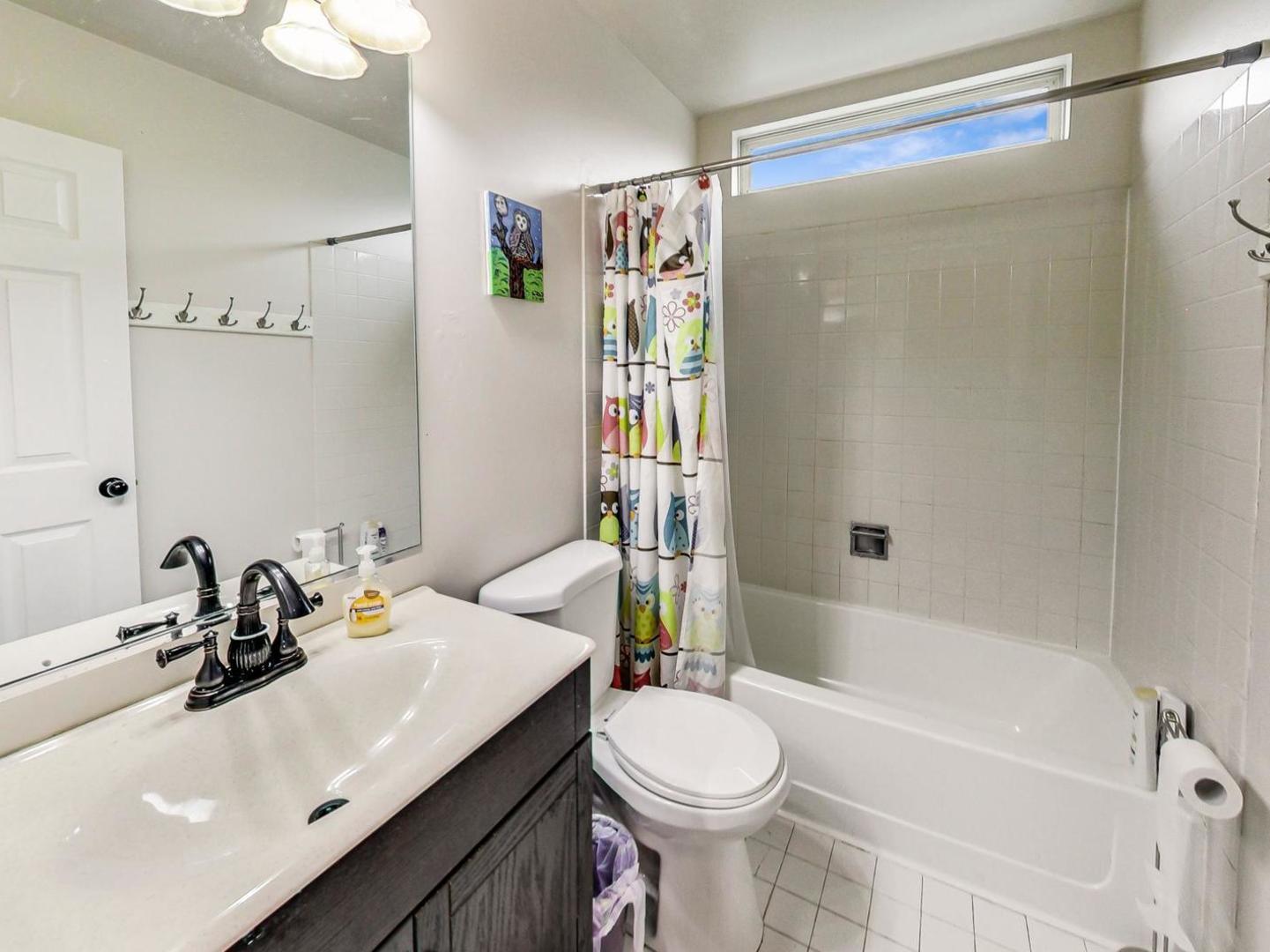 2385 North Periwinkle Way Round Lake Beach, IL 60073 - Photo 36 of 51 a bathroom with a sink a toilet and shower