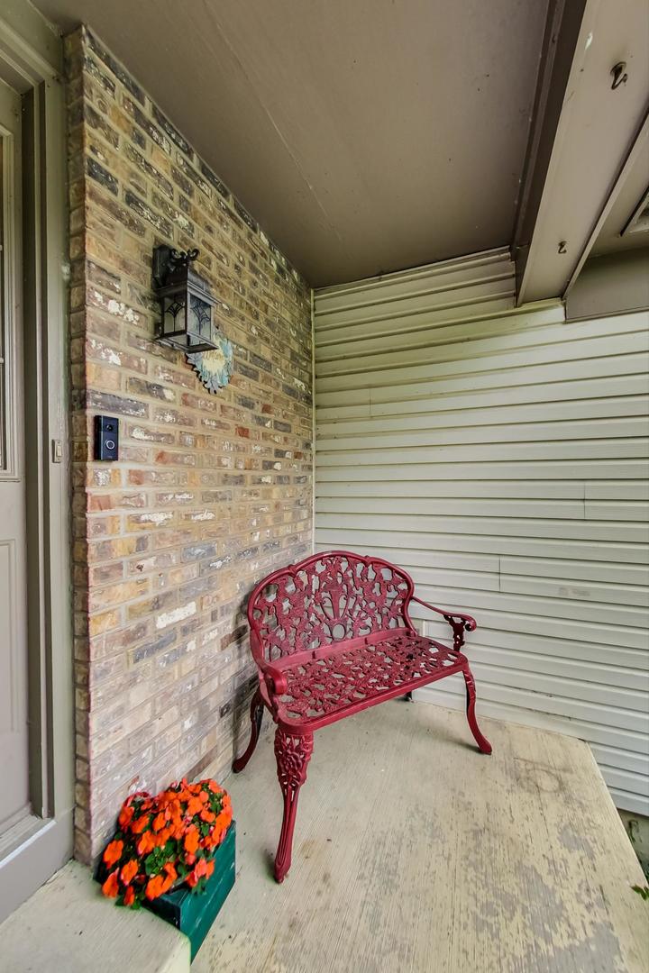 2385 North Periwinkle Way Round Lake Beach, IL 60073 - Photo 4 of 51 a view of a porch with a bench